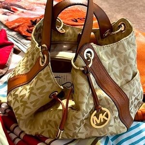 Michael Kors purse good condition tan and burnt orange color